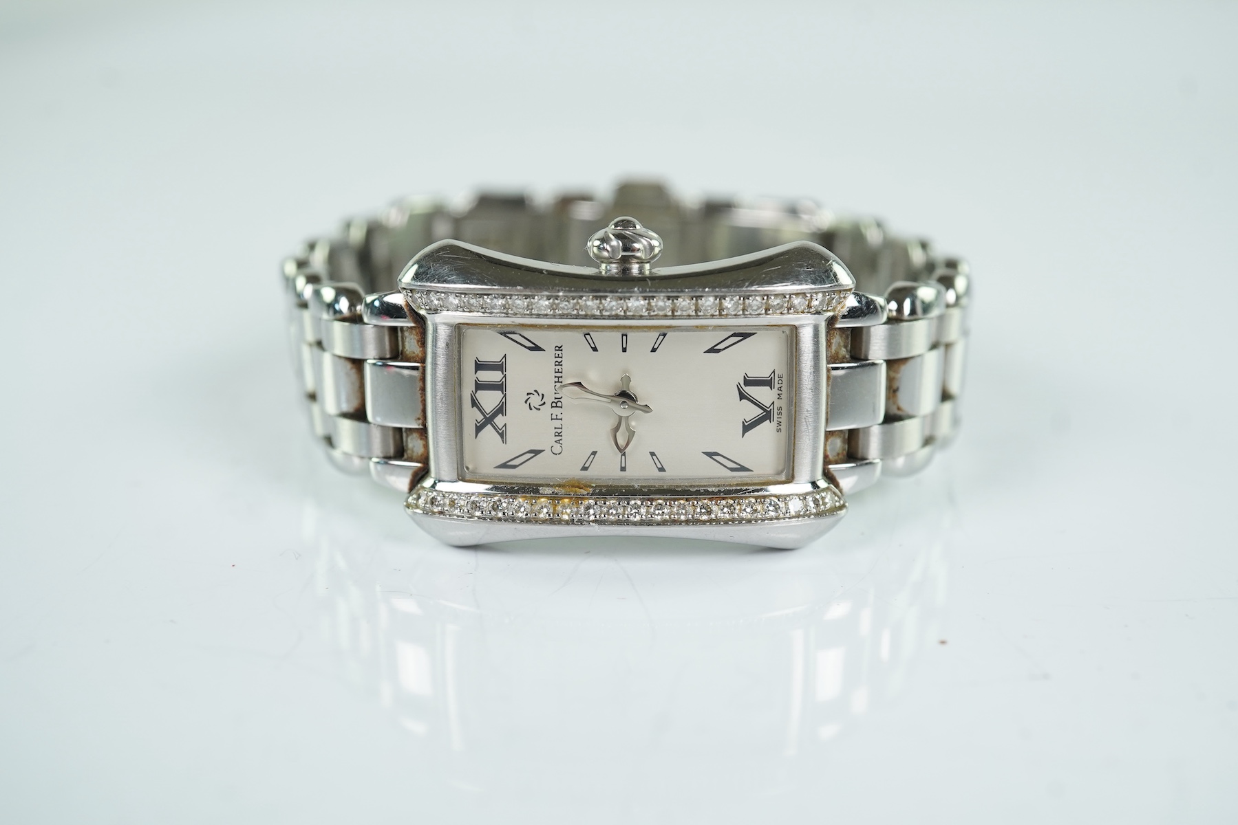 A lady's 2007 stainless steel and diamond set Carl F. Bucherer quartz wrist watch, on a stainless steel bracelet